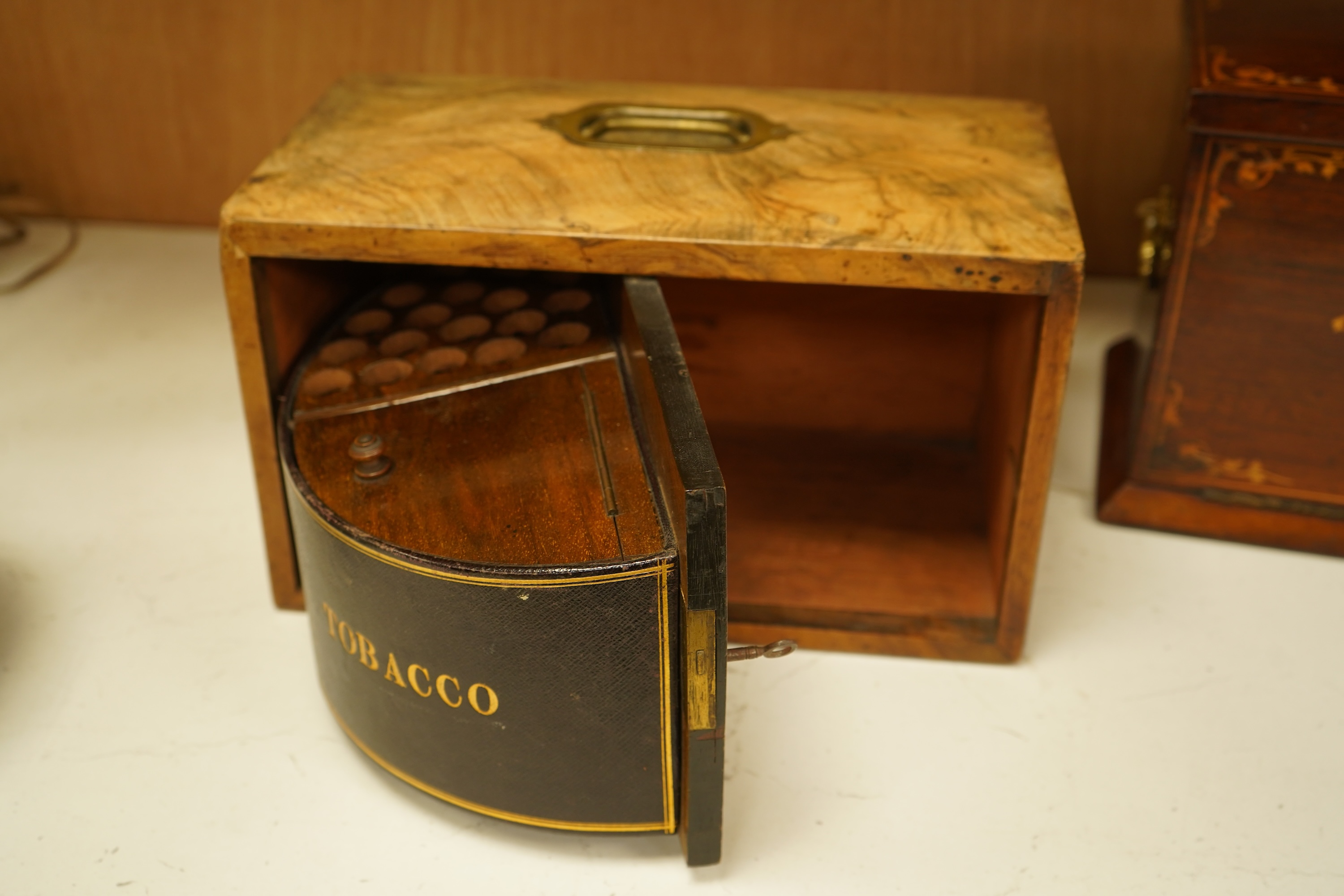 An Edwardian inlaid mahogany writing casket with fitted interior and a late Victorian faded walnut cigar box, largest 32cm wide